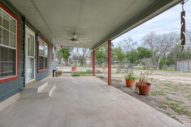 view of patio / terrace featuring ceiling fan and fence