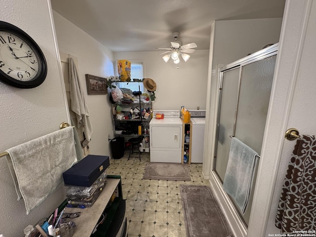 bathroom with ceiling fan, washer and clothes dryer, and an enclosed shower