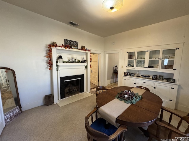 view of carpeted dining space