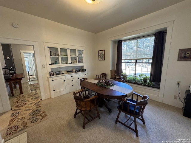 dining area with light carpet