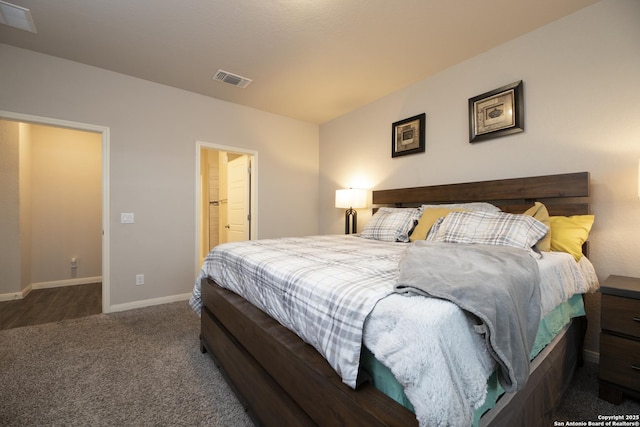 carpeted bedroom featuring connected bathroom