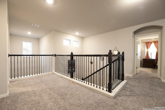 corridor featuring carpet flooring