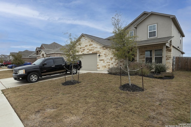 front of property featuring a garage and a front yard