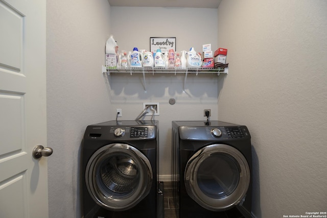 clothes washing area featuring separate washer and dryer