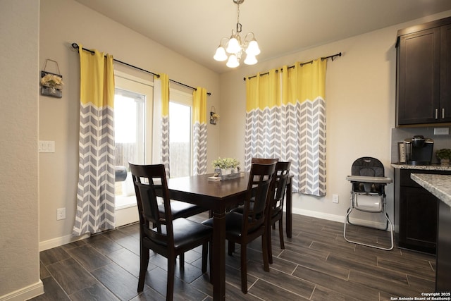 dining room with an inviting chandelier and a healthy amount of sunlight