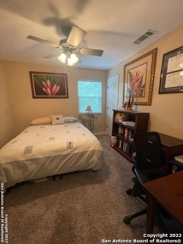 carpeted bedroom featuring ceiling fan