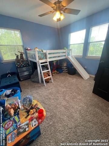 bedroom featuring ceiling fan and carpet floors