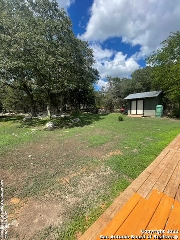 view of yard with a storage unit