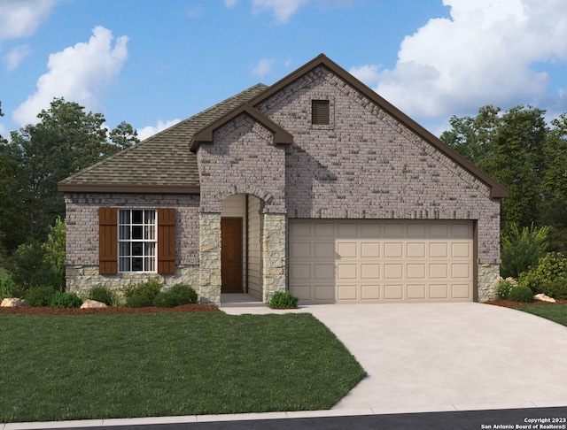 view of front of house featuring a front lawn and a garage