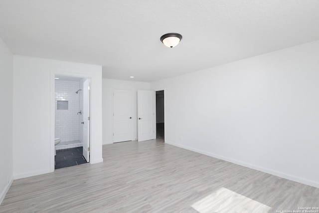 spare room featuring light wood-type flooring