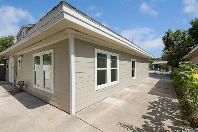 view of property exterior featuring a patio