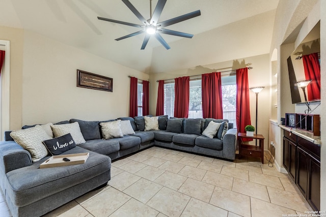 living room featuring ceiling fan, light tile patterned flooring, and vaulted ceiling