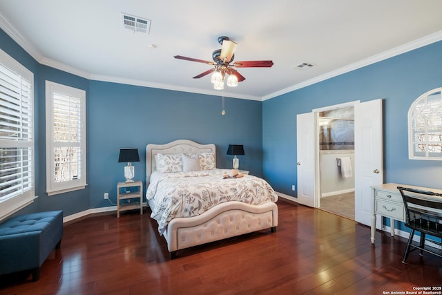 bedroom with dark hardwood / wood-style floors, ensuite bathroom, ornamental molding, and ceiling fan