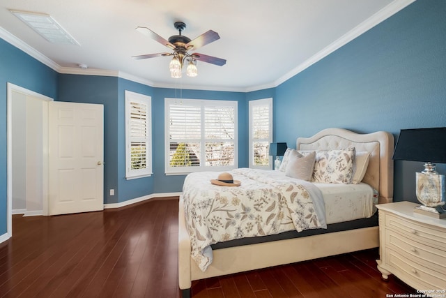 bedroom featuring crown molding, dark wood-type flooring, and ceiling fan