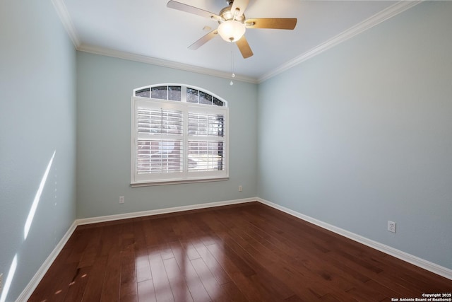 empty room featuring dark hardwood / wood-style flooring, ornamental molding, and ceiling fan