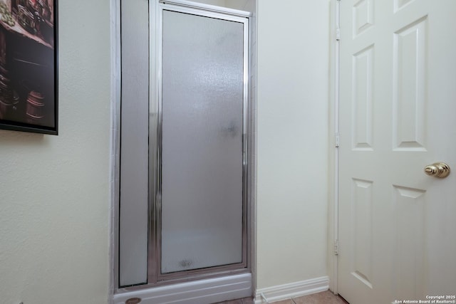 bathroom featuring an enclosed shower