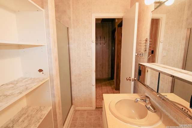 bathroom with vanity, tile patterned floors, and walk in shower