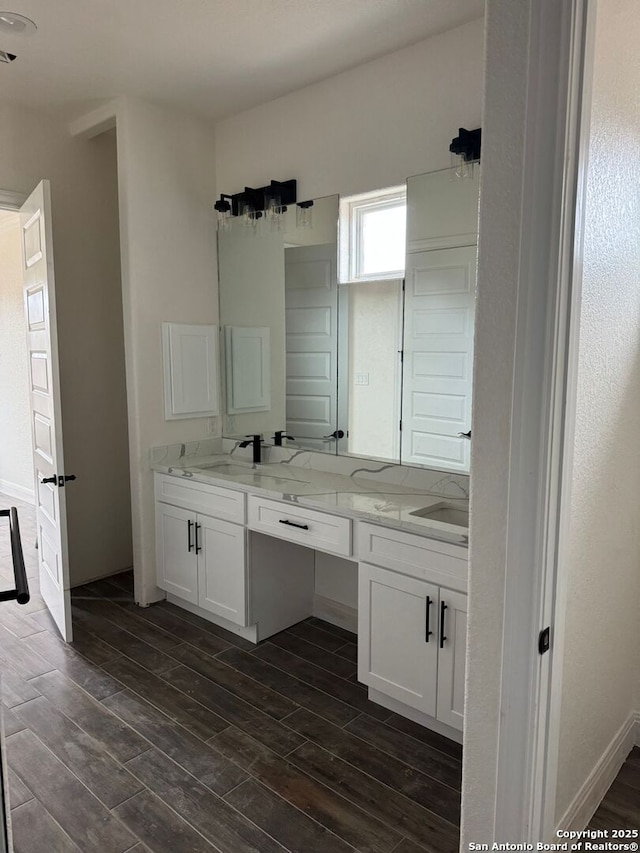 bathroom featuring vanity and hardwood / wood-style floors