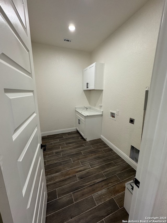 laundry room featuring cabinets, washer hookup, and electric dryer hookup