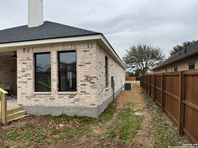 view of home's exterior with central AC unit