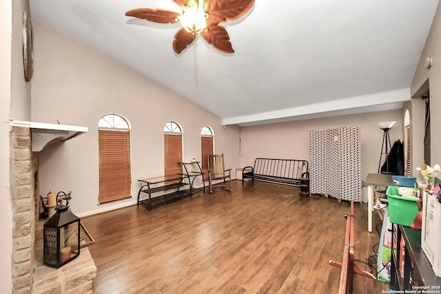 living room featuring ceiling fan, hardwood / wood-style floors, and high vaulted ceiling