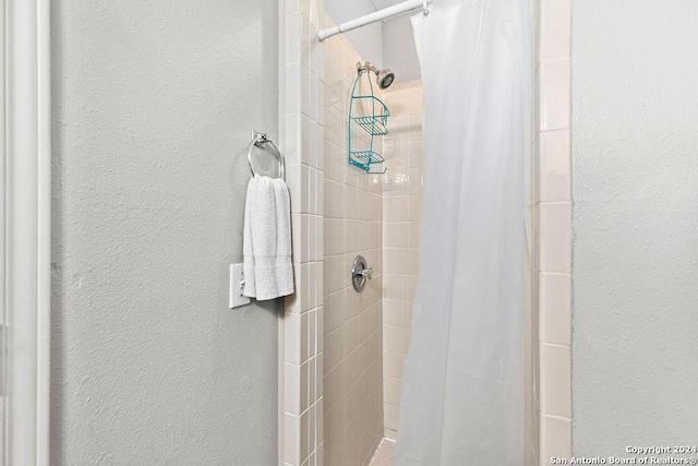 bathroom with a shower with curtain