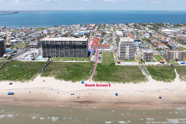 drone / aerial view with a view of the beach and a water view