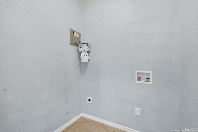 clothes washing area with washer hookup and hookup for an electric dryer