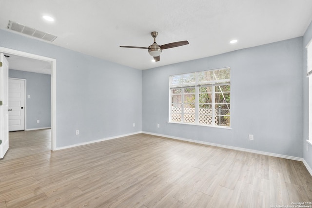 spare room with ceiling fan and light hardwood / wood-style floors