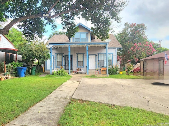 bungalow-style house with a front lawn and a porch