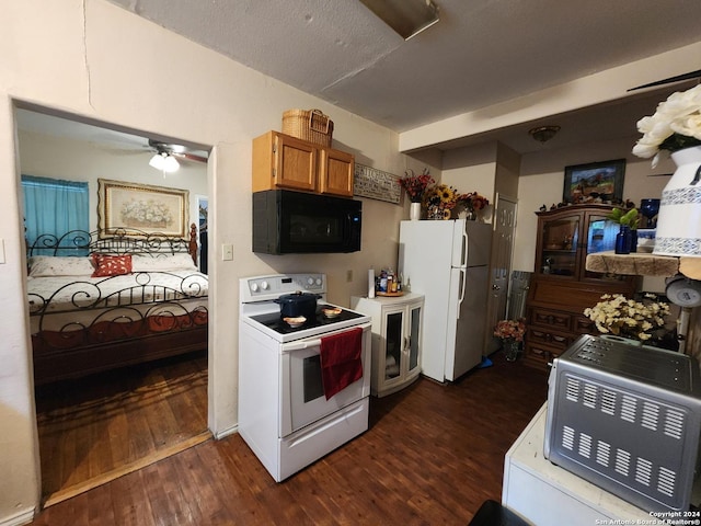 kitchen with ceiling fan, dark wood-type flooring, and white appliances