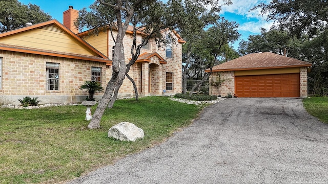 view of front of house featuring a garage and a front yard