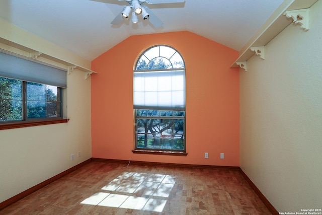 unfurnished room featuring lofted ceiling and ceiling fan