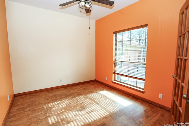 unfurnished room with ceiling fan