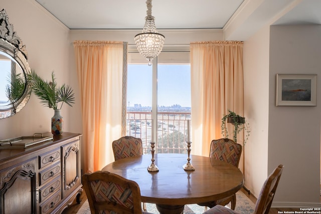 dining area with an inviting chandelier