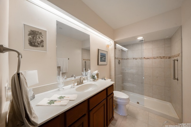 bathroom featuring tile patterned floors, vanity, toilet, and a shower with door