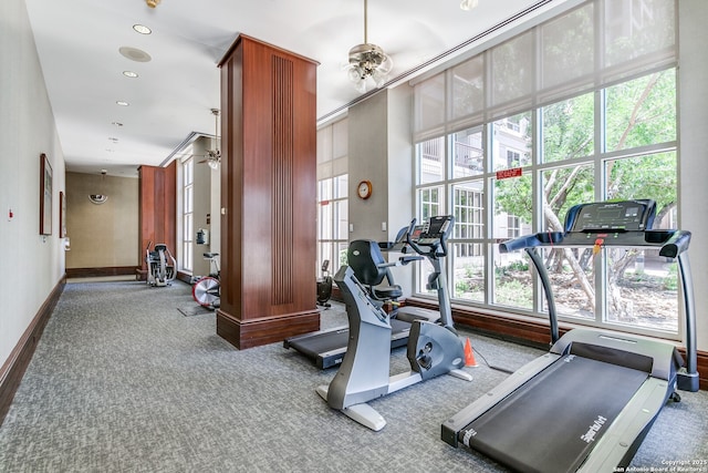 workout area featuring light colored carpet and ceiling fan