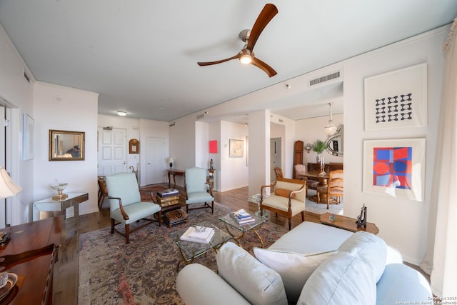 living room with ceiling fan and wood-type flooring