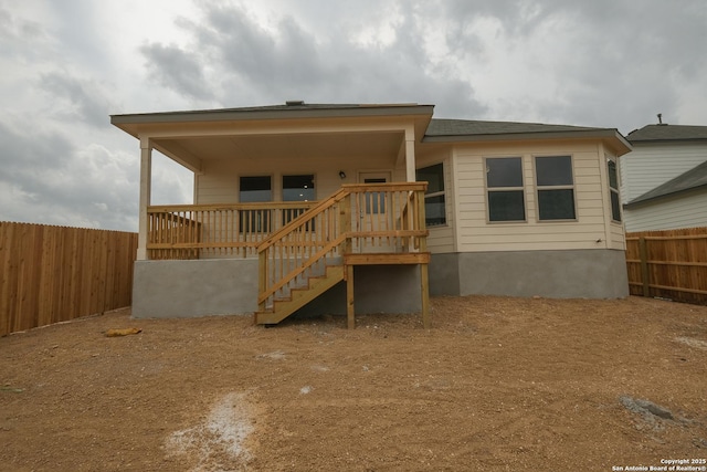 8321 Roadrunner Psge, San Antonio, TX 78222 - rear view of property with stairway and a fenced backyard
