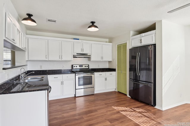 kitchen with dark wood-type flooring, sink, white cabinetry, and stainless steel appliances