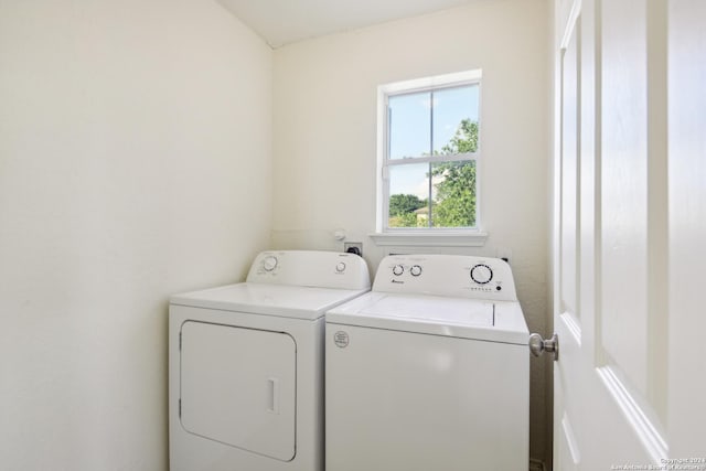 washroom featuring washing machine and dryer