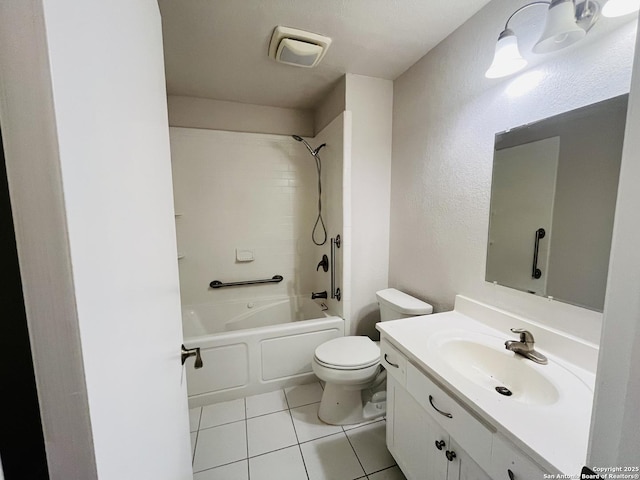 full bathroom with toilet, tiled shower / bath combo, vanity, and tile patterned floors