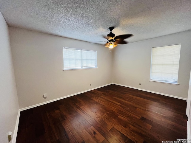 spare room with ceiling fan, plenty of natural light, hardwood / wood-style floors, and a textured ceiling