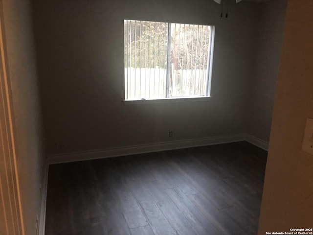 spare room featuring dark hardwood / wood-style floors