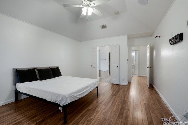 bedroom featuring ceiling fan, wood-type flooring, and lofted ceiling