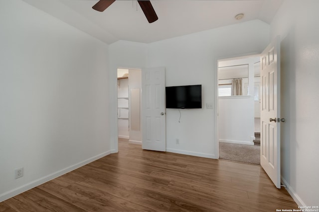 interior space featuring vaulted ceiling, ceiling fan, and hardwood / wood-style flooring