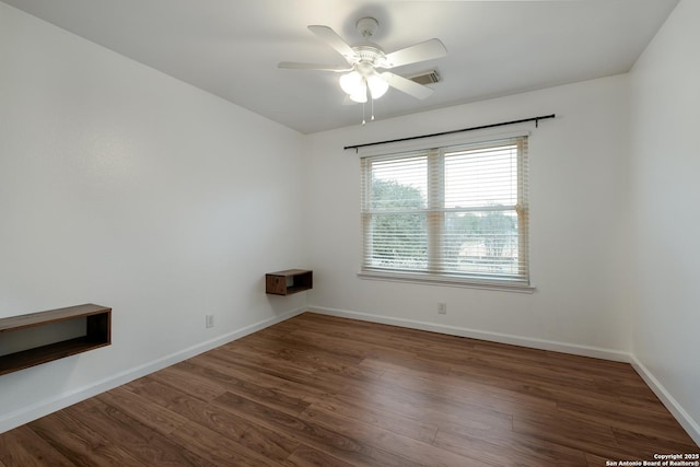 unfurnished room featuring ceiling fan and dark hardwood / wood-style floors