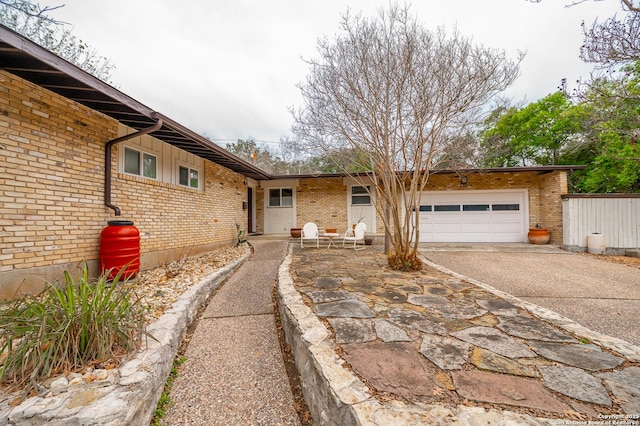 ranch-style home with a garage