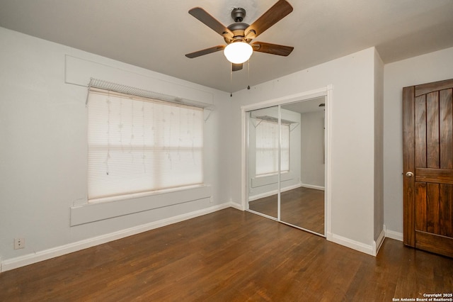 unfurnished bedroom featuring ceiling fan, a closet, and dark hardwood / wood-style flooring