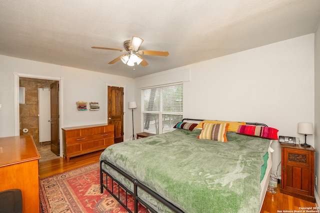 bedroom featuring ceiling fan and hardwood / wood-style floors